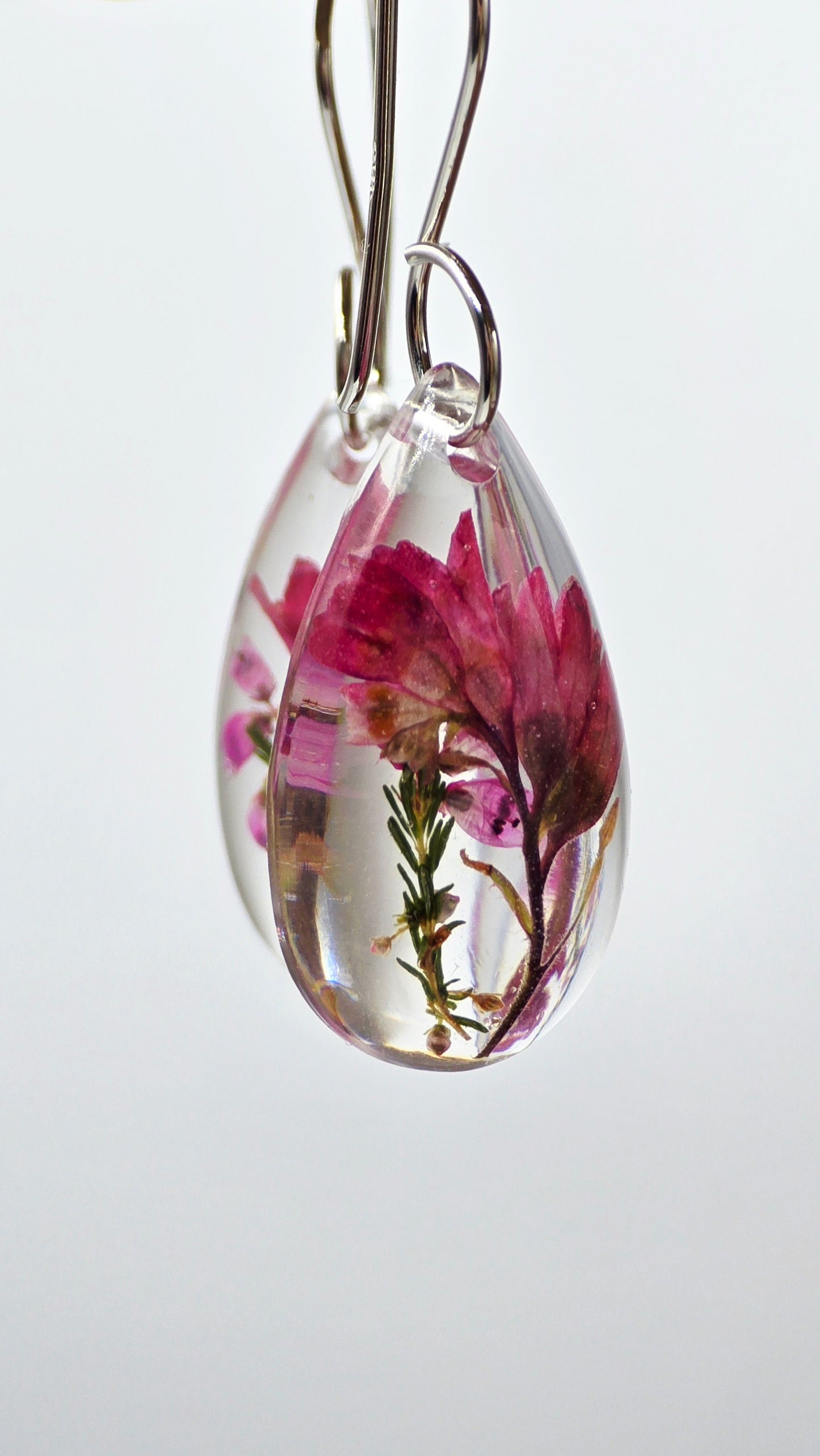 Earrings featuring wildflower specimens of Preserved Coral Bells & Heather Flower, secured on a .925 Sterling Silver Shepherd Hook