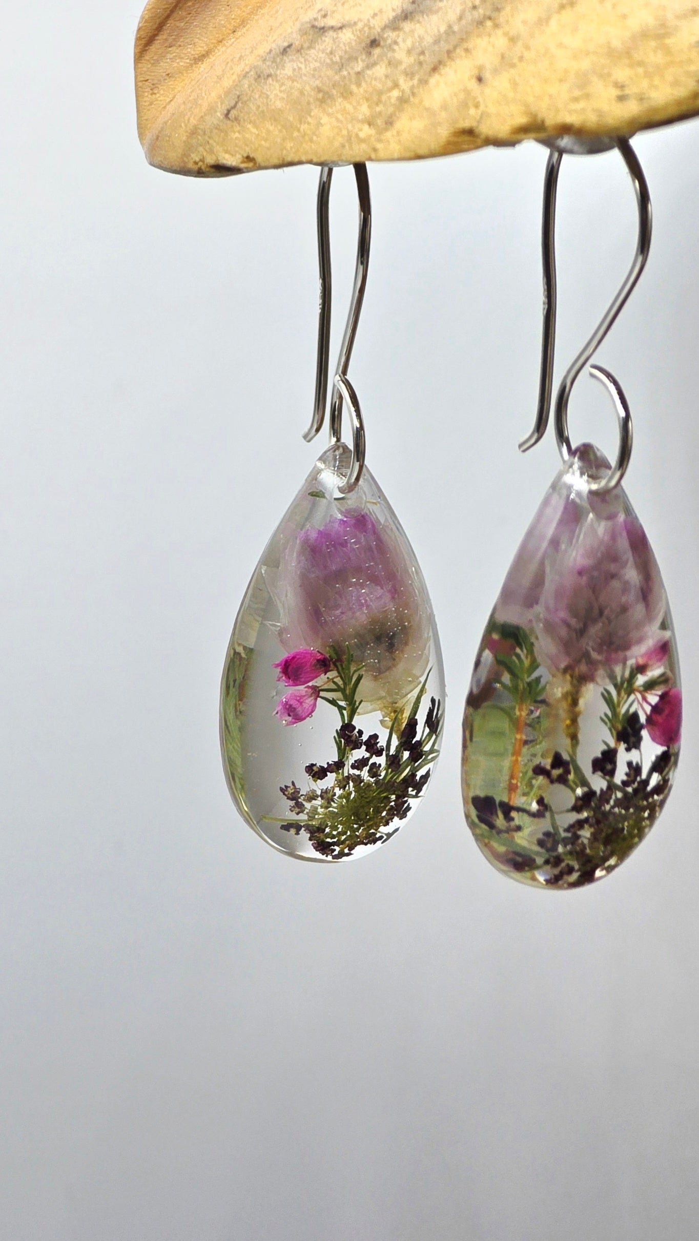 Earrings featuring wildflower specimens of Preserved Rhodanthe, Heather & Chocolate Queen Annes Lace secured on a .925 Sterling Silver Hook