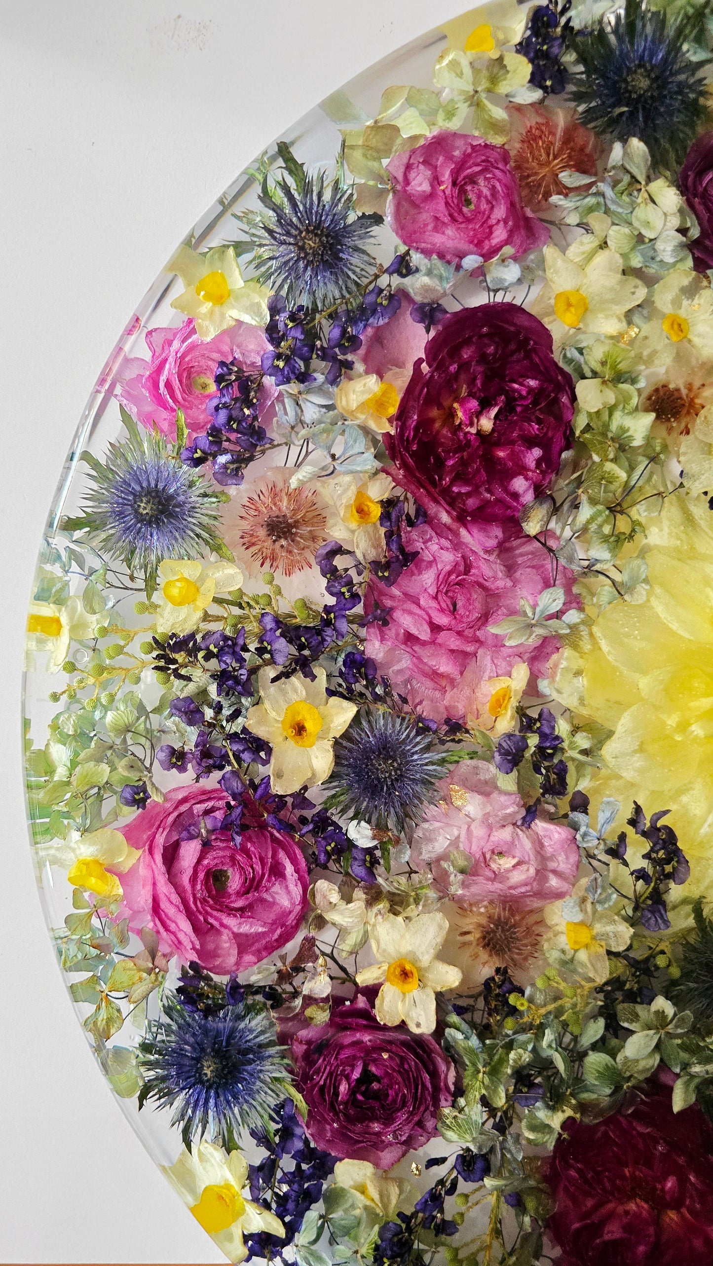 450mm Round Flower Board, complete with Lazy Susan, featuring  real preserved Ranunculus, Dahlias, Hydrangeas, pink Roses, Sea Holly, Hardenbergia, Jonquils & Blushing Bride set in Resin