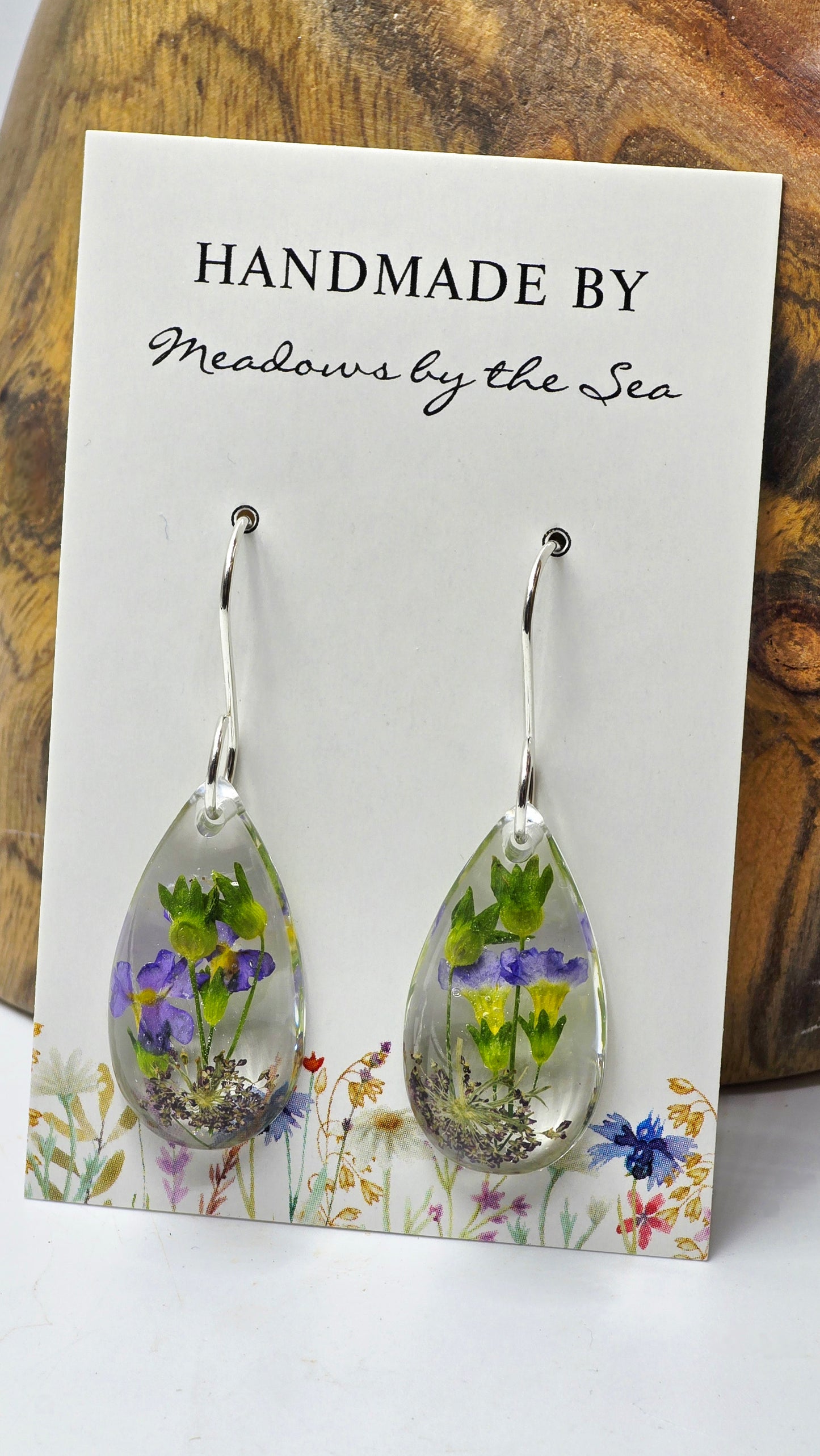 Earrings featuring wildflower specimens of Preserved Primula & Chocolate Queen Annes Lace, secured on a .925 Sterling Silver Hook