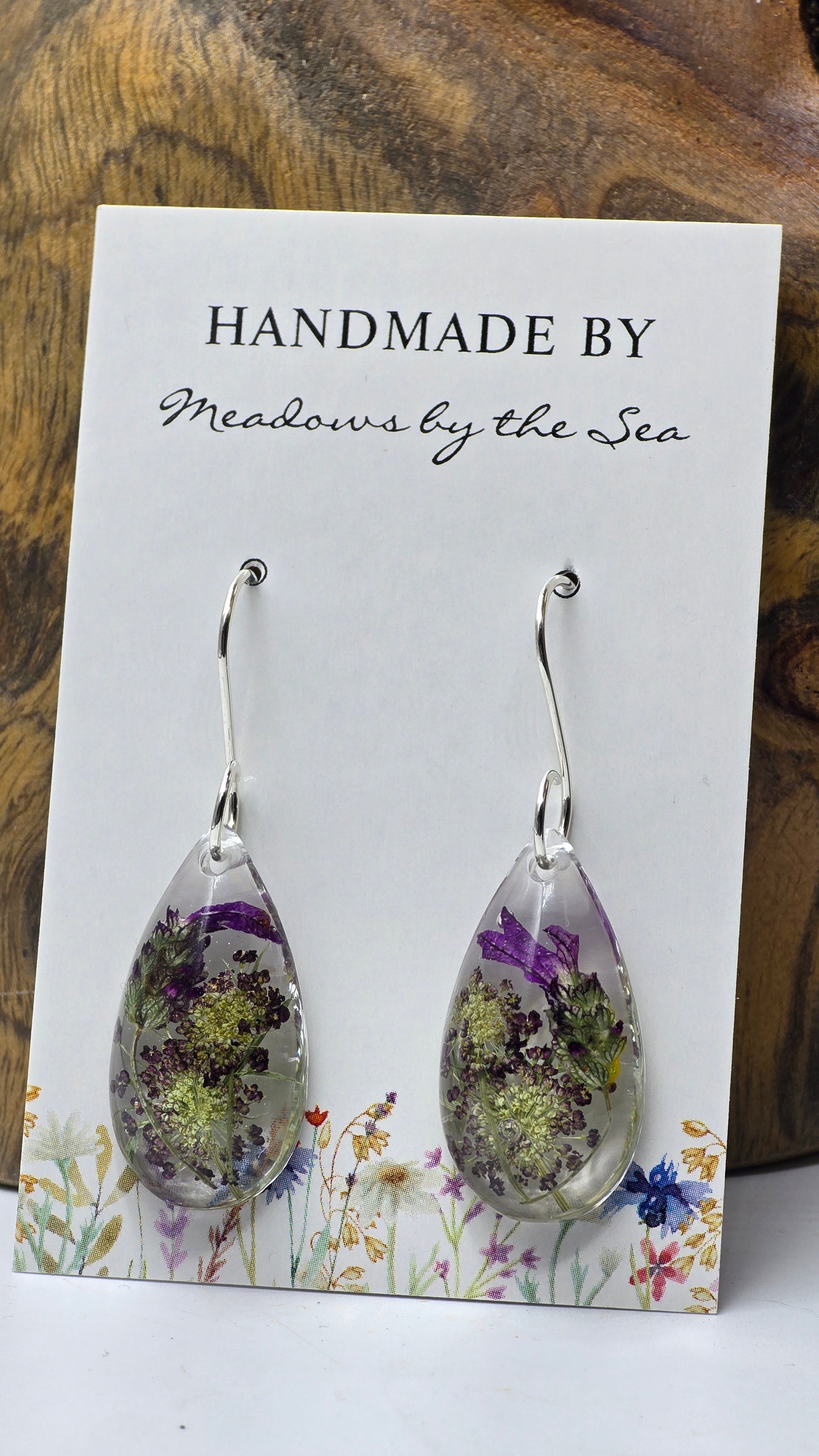 Earrings featuring wildflower specimens of Preserved Lavender and Chocolate Queen Annes Lace, secured on a .925 Sterling Silver Shepherd Hook