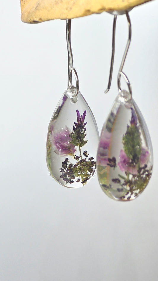 Earrings featuring wildflower specimens of Preserved Rhodanthe, Lavender & Chocolate Queen Anne's Lace, secured on a .925 Sterling Silver Hook