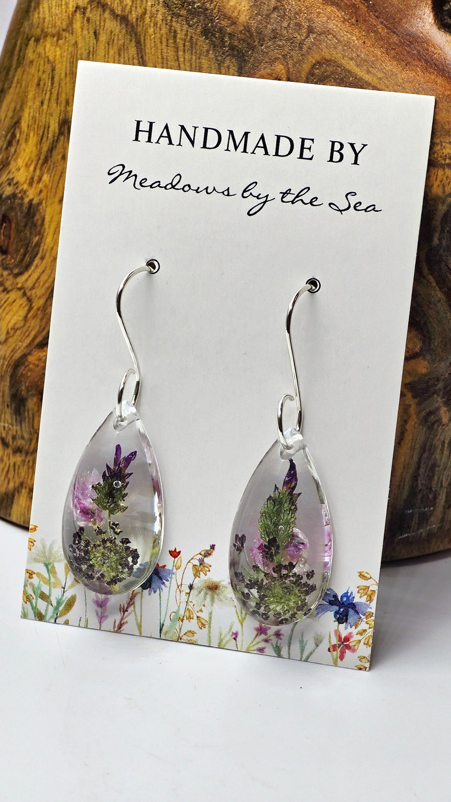 Earrings featuring wildflower specimens of Preserved Rhodanthe, Lavender & Chocolate Queen Anne's Lace, secured on a .925 Sterling Silver Hook