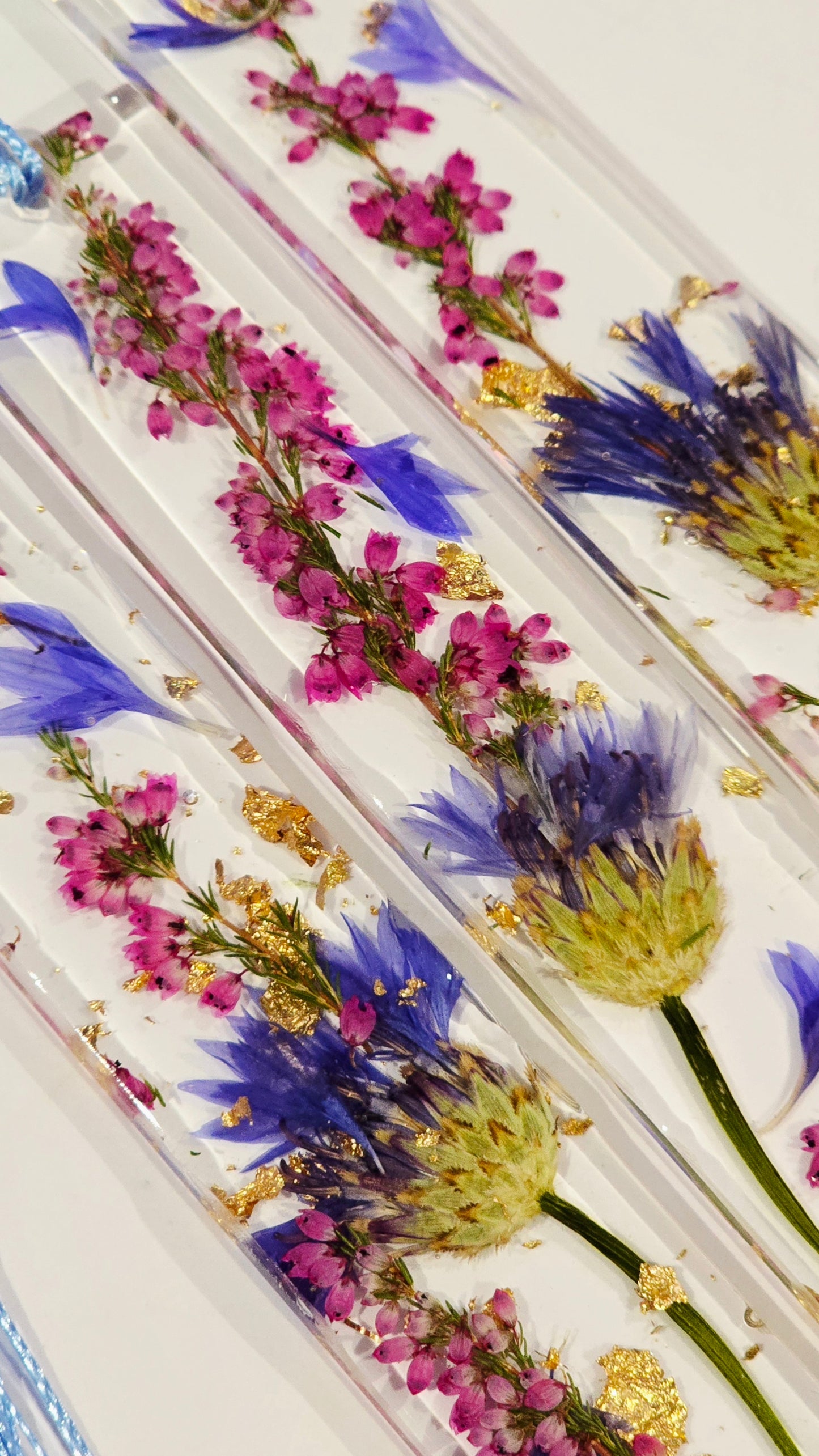 Bookmark featuring a single Cornflower with Heather and Gold Flakes