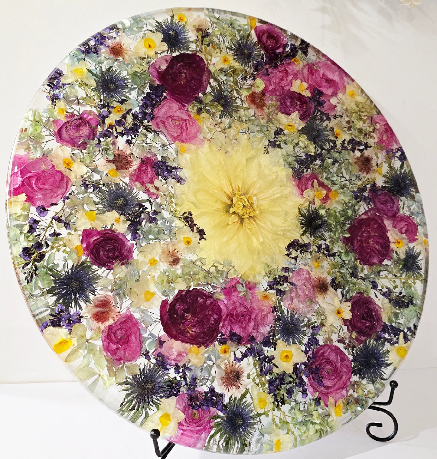 450mm Round Flower Board, complete with Lazy Susan, featuring  real preserved Ranunculus, Dahlias, Hydrangeas, pink Roses, Sea Holly, Hardenbergia, Jonquils & Blushing Bride set in Resin