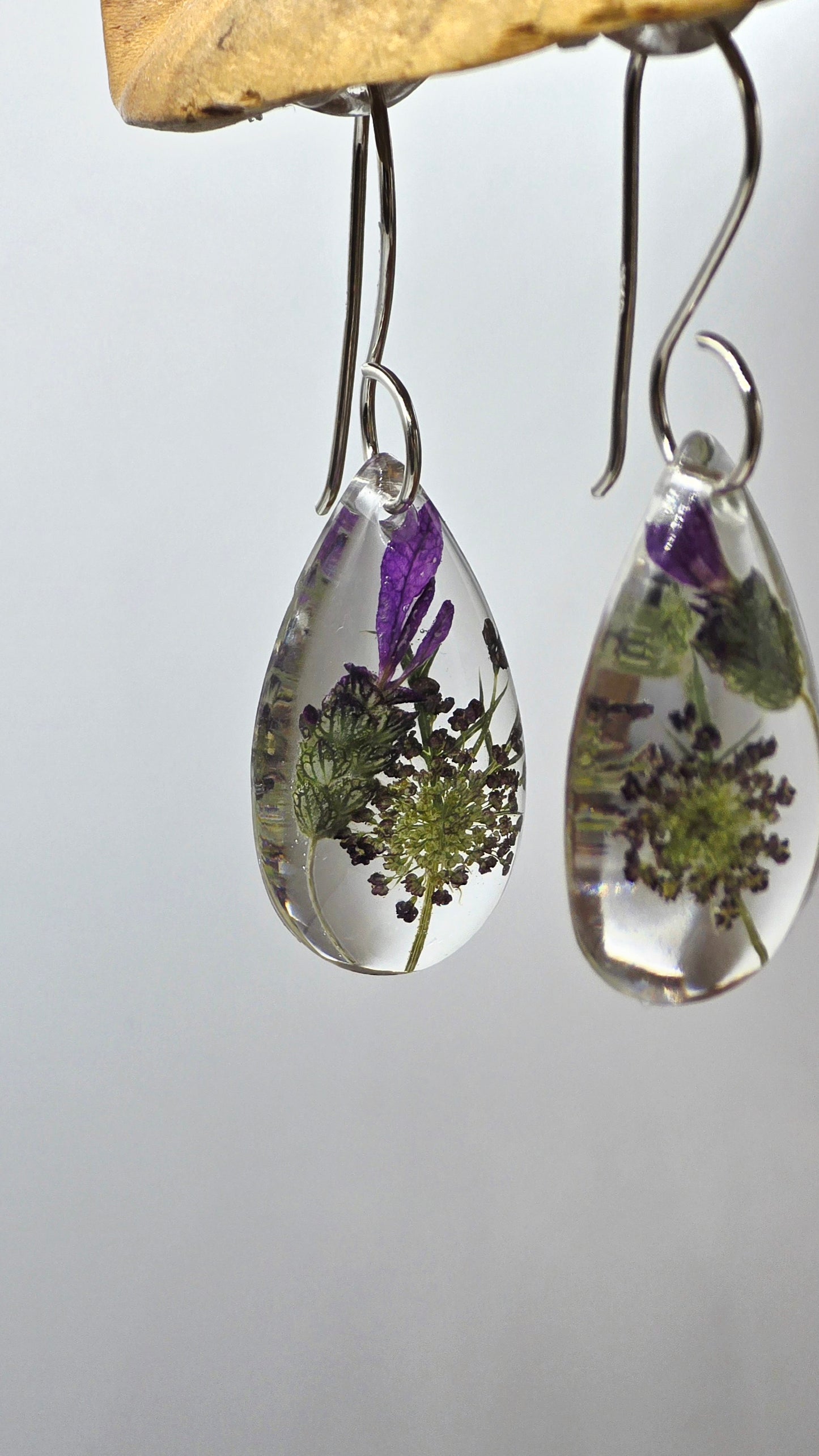Earrings featuring wildflower specimens of Preserved Lavender & Chocolate Queen Anne's Lace, secured on a .925 Sterling Silver Hook