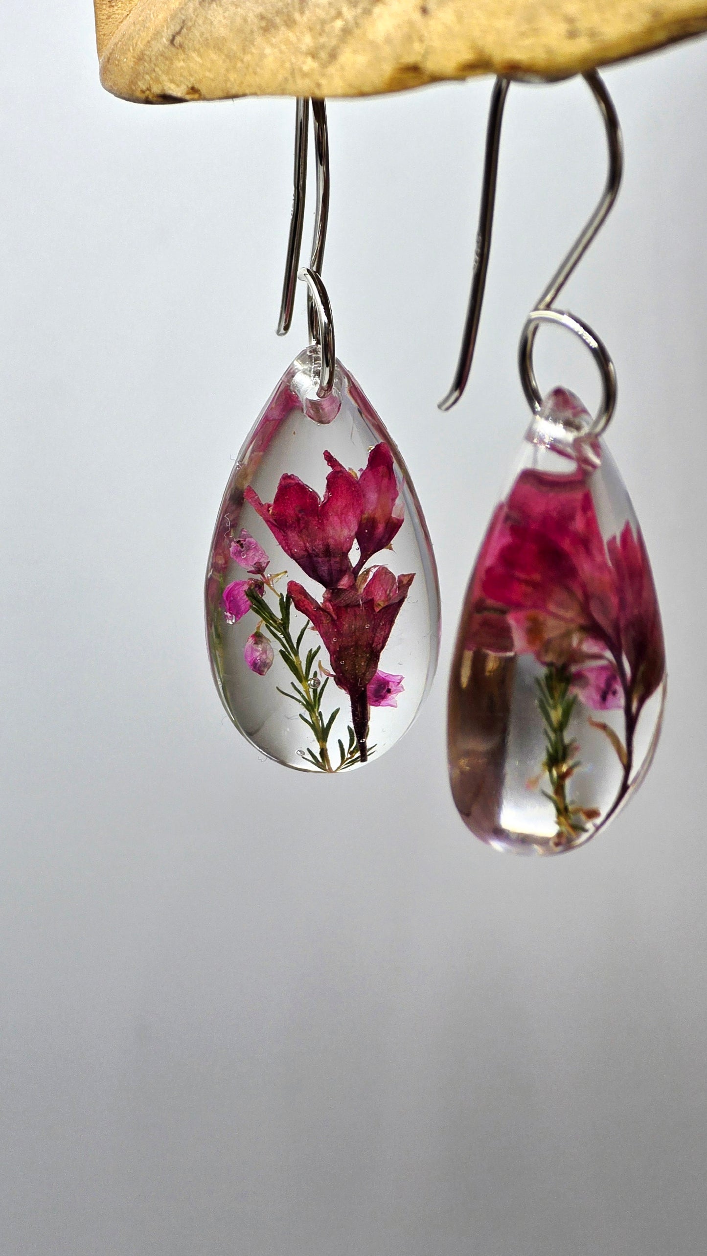 Earrings featuring wildflower specimens of Preserved Coral Bells & Heather Flower, secured on a .925 Sterling Silver Shepherd Hook