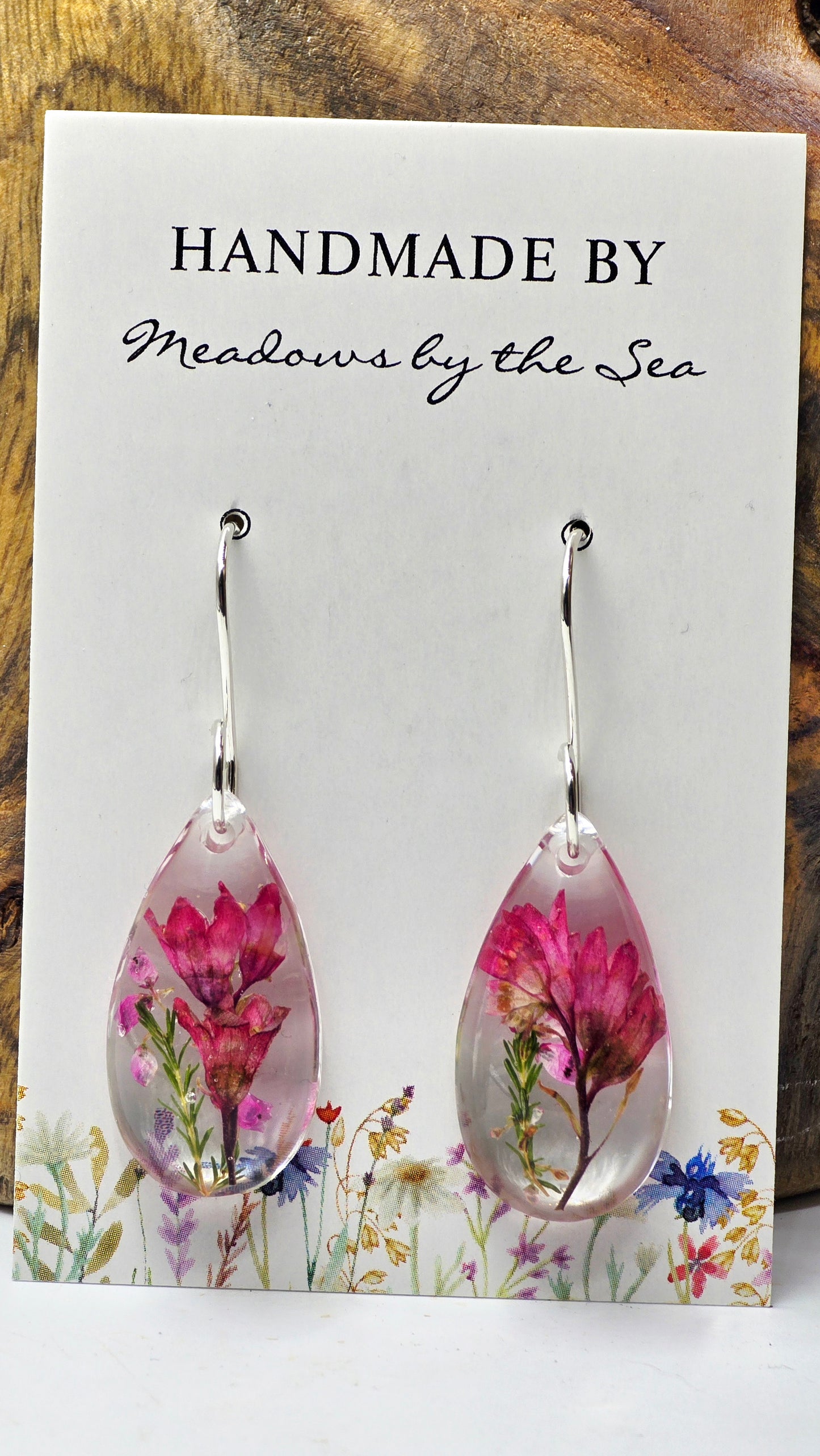 Earrings featuring wildflower specimens of Preserved Coral Bells & Heather Flower, secured on a .925 Sterling Silver Shepherd Hook